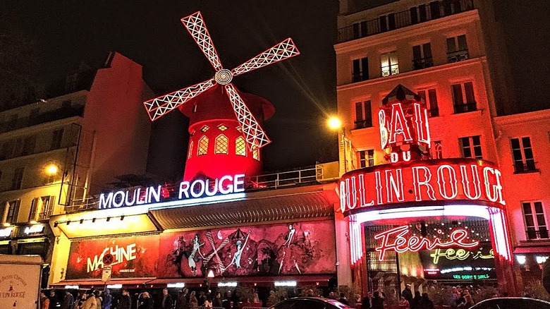 building with windmill and red lights