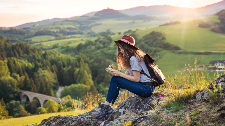 woman in nature writing