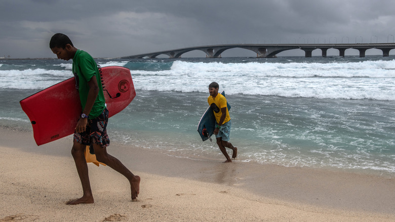 Men at beach in Malé, Maldives