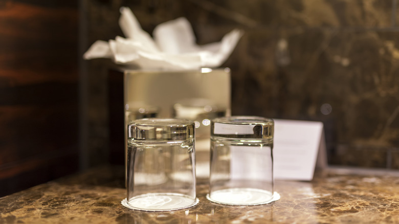 hotel room glasses on a table