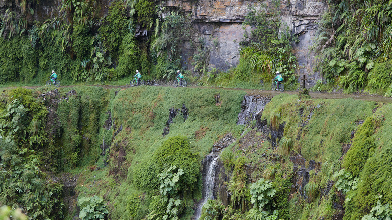 Mountain bikers on North Yungas Road in Bolivia