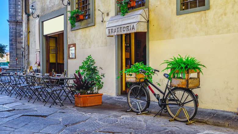 bike resting on trattoria wall