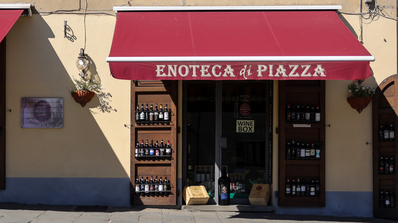 enoteca storefront with wine bottles