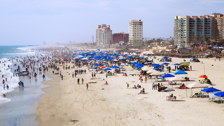 A busy beach in Rosarito, Mexico