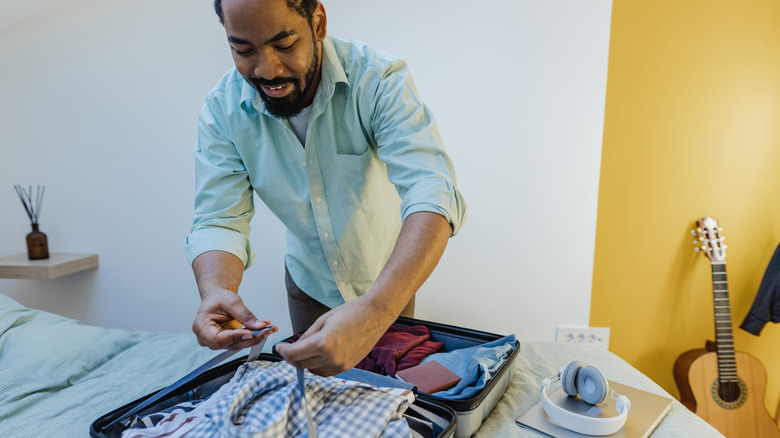 Man packing a suitcase