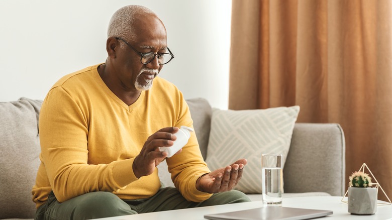 man taking a pill