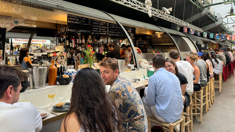 People dining in the market