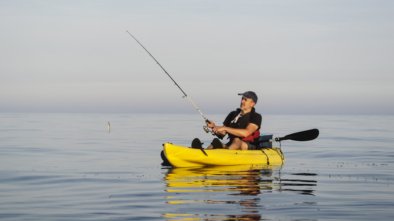 Kayaker fishing on the ocean