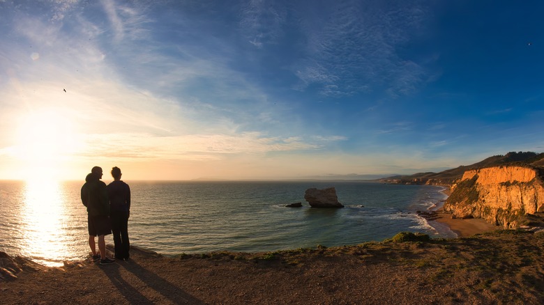 Couple on a sunset hike along Bodega Bay