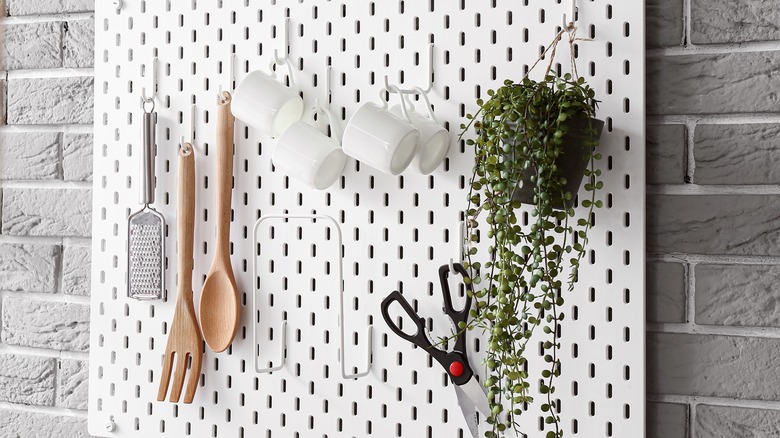 Pegboard with kitchen utensils