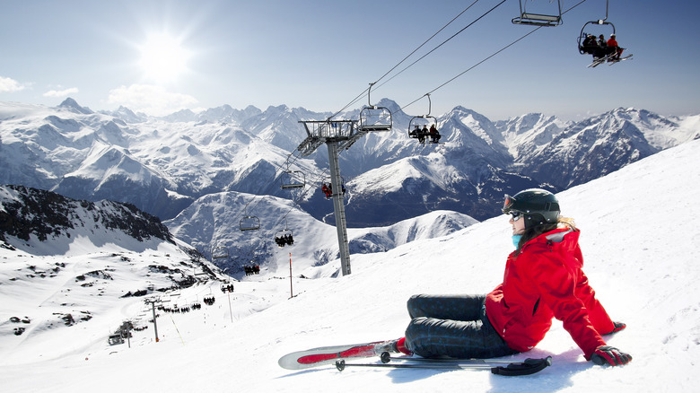 skier sitting on mountain side