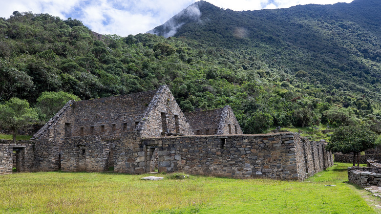 brick building nestled in the foothills of mountains