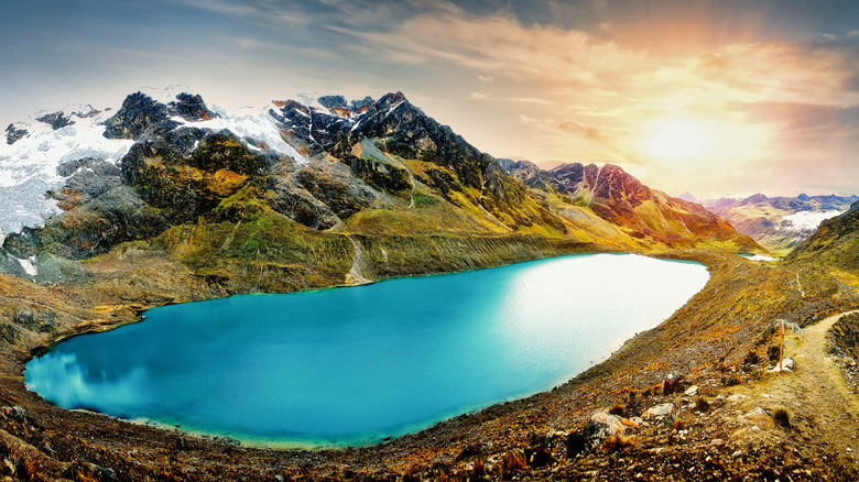 the blue waters of Humantay Lake surrounded by mountains