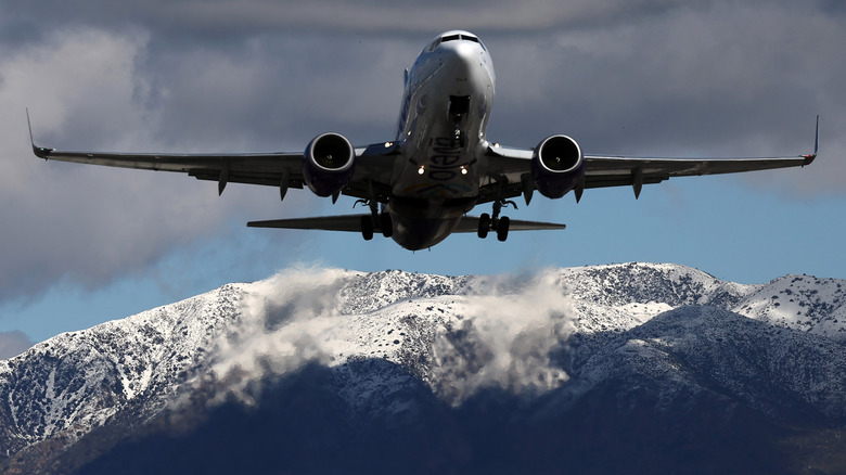 Plane flying over mountains