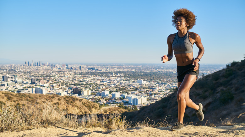 Woman running across Runyon Canyon