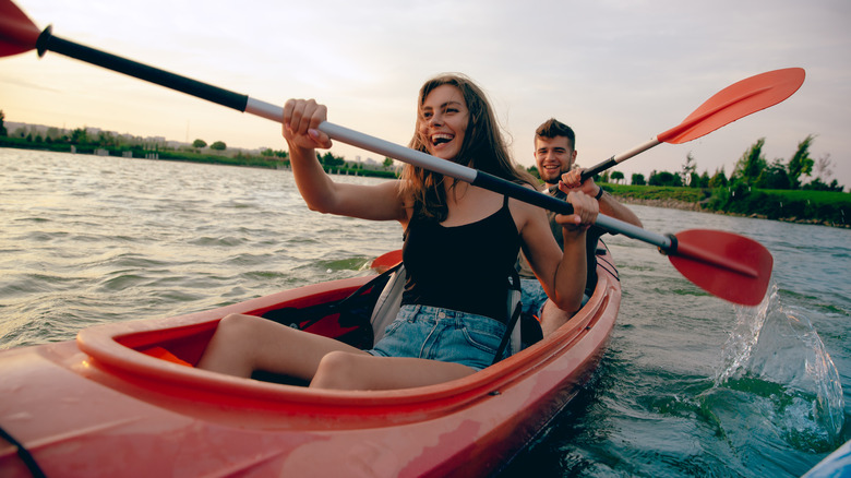 Couple kayaking together on a lake