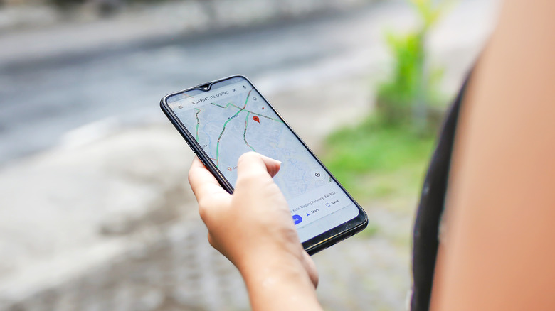 person using google maps app