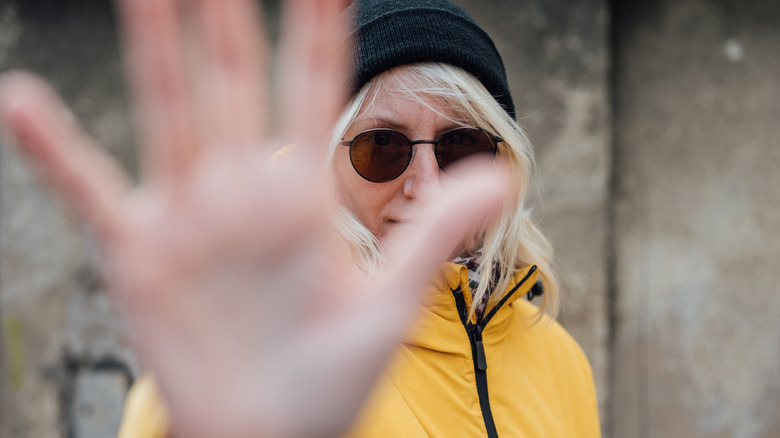 Woman making a "moutza" gesture