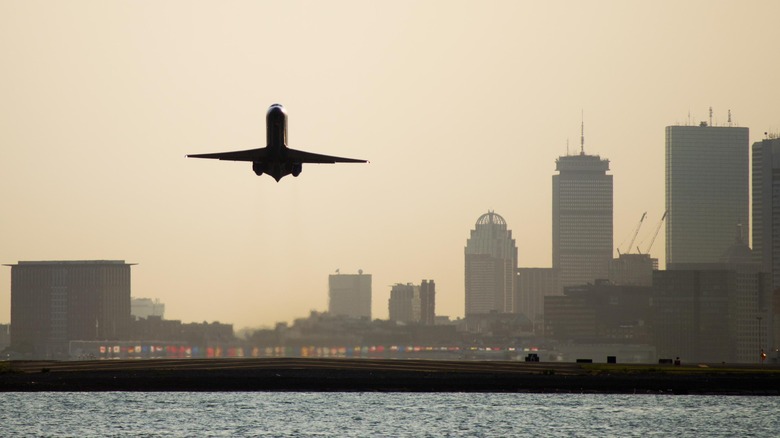 Airplane takes off Boston bay