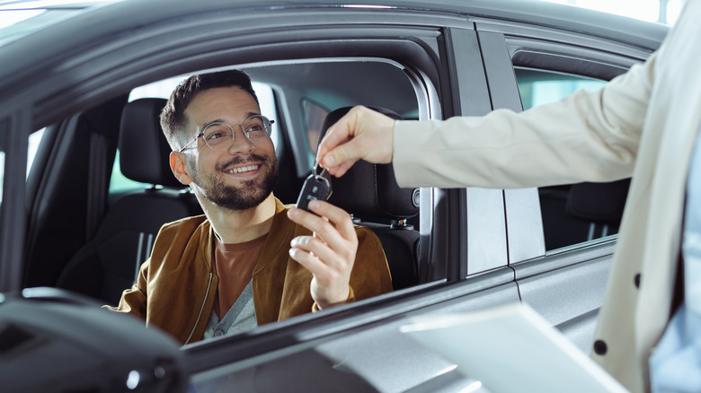 Man receiving car keys
