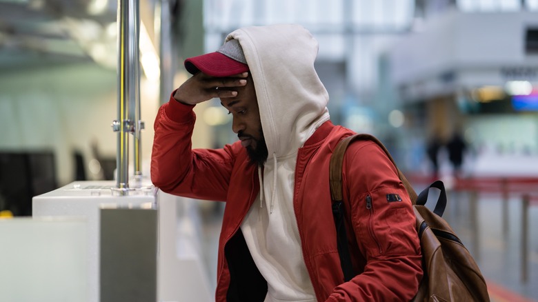 Man dealing with airport anxiety