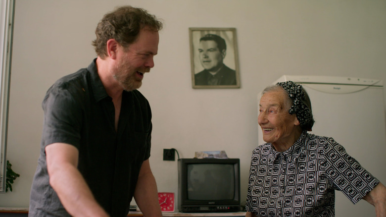 Rainn Wilson laughing with older woman