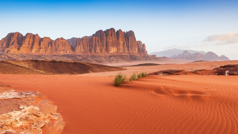 Red sand desert with mountains