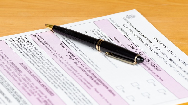 passport application form with pen