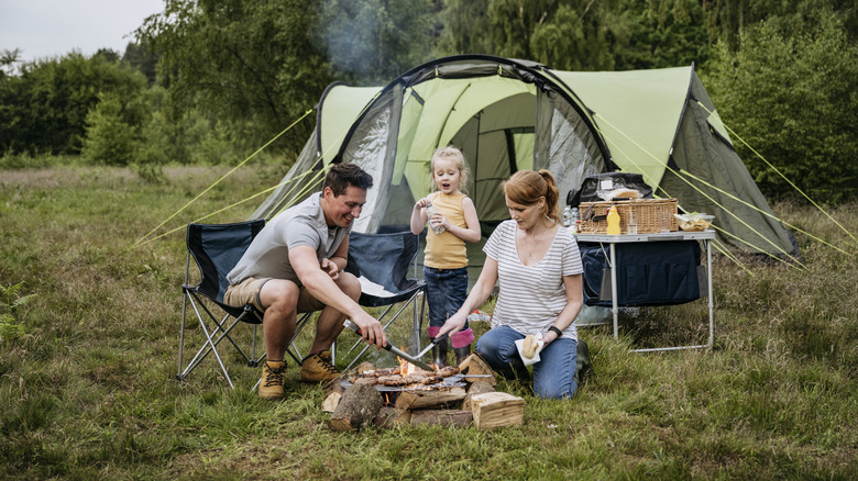 Family cooking at campsite