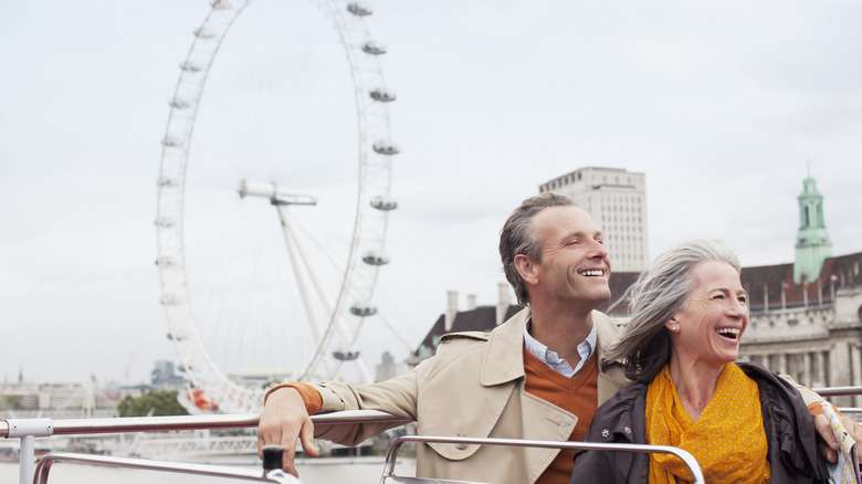 Elder couple with London Eye