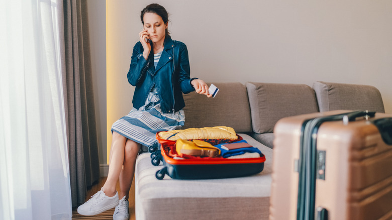 Woman in hotel on phone