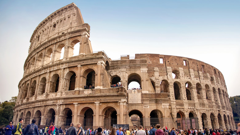 Colosseum looming over tourists in Rome