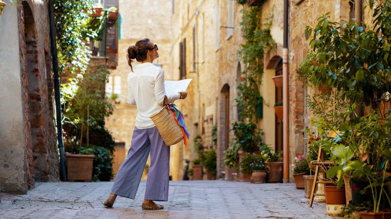 woman strolling through Tuscan
