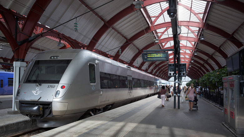 A train awaits passengers in a Swedish station