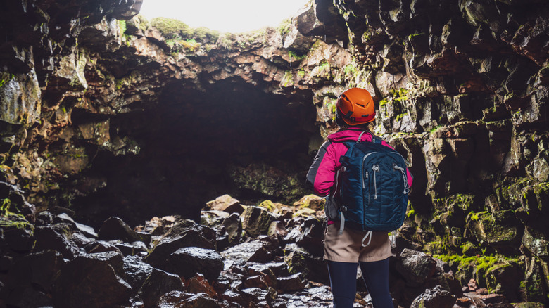 Woman in lava tunnel iceland