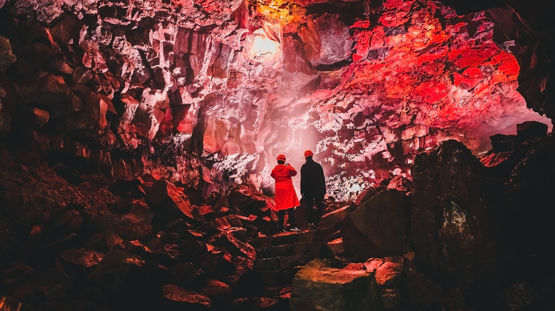 two people in iceland lava tunnel