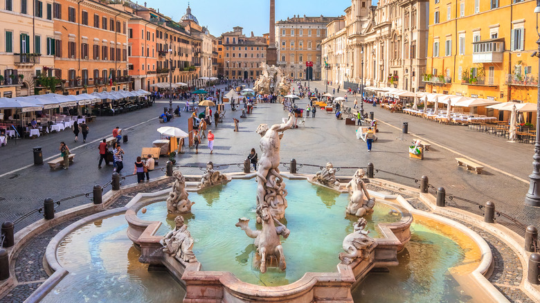 fountain and people in piazza