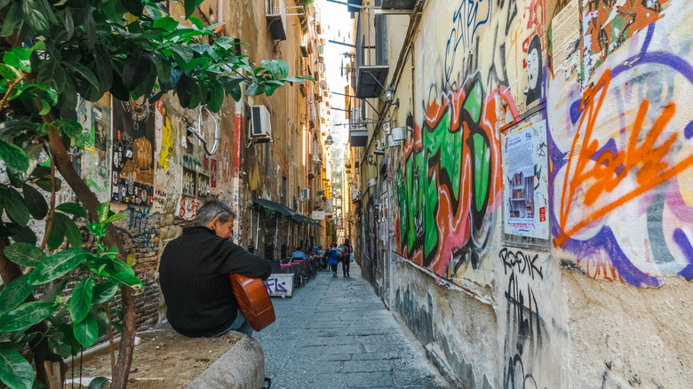 man in Naples alley