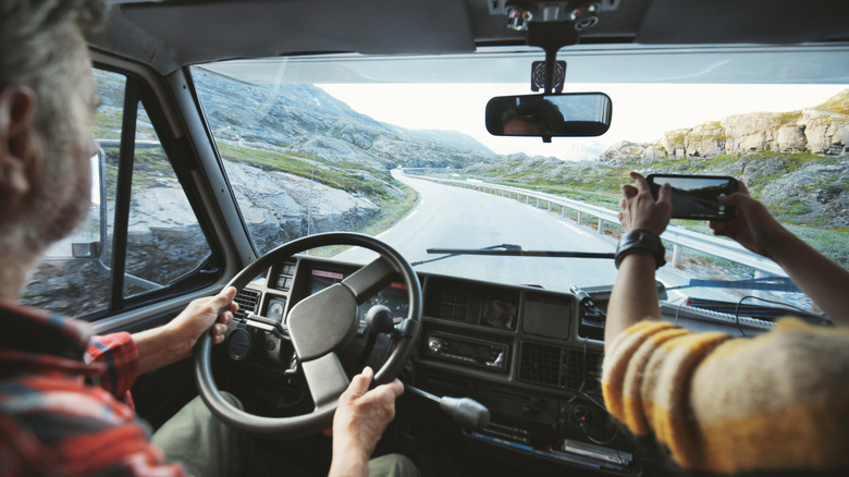 Two travelers driving in Norway