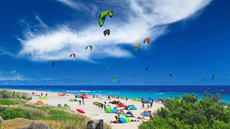 Kitesurfers flying over a Tarifa beach