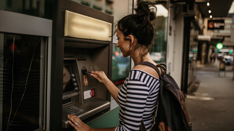 woman using ATM machine