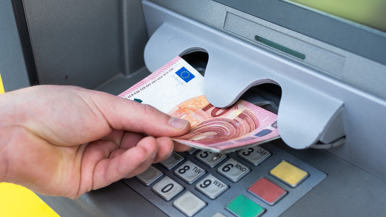 withdrawing cash from ATM