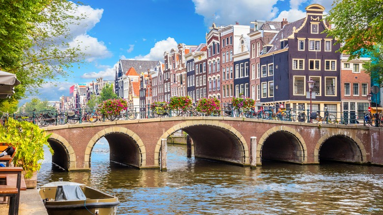 Amstel River bridge Amsterdam houses