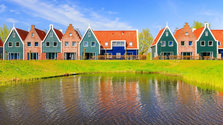 green orange houses Volendam pond