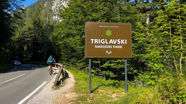 Cyclist and car on Vršič Pass