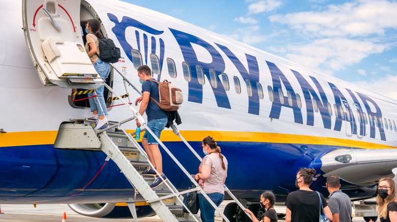 People boarding an airplane