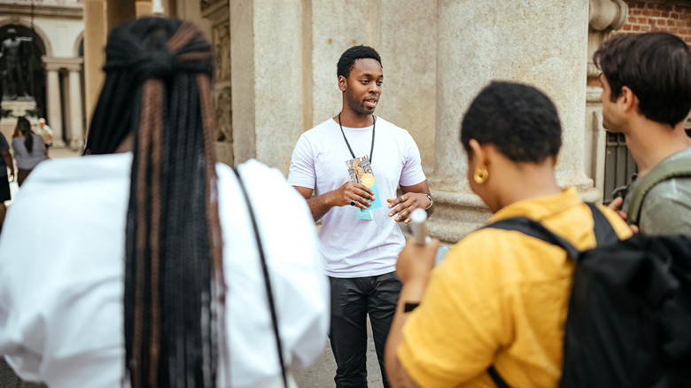 Guide showing tourists around