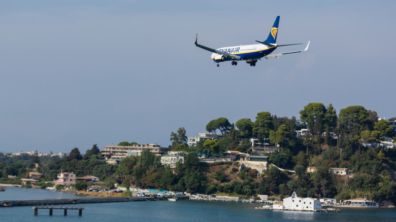 Ryanair plane flying in air over Greek coast