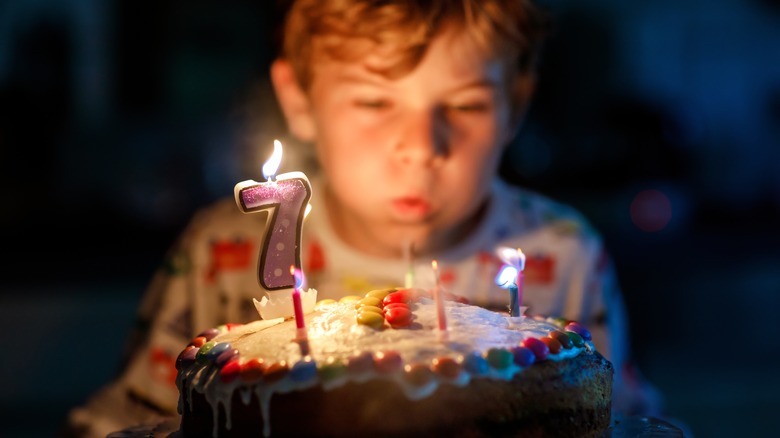 7-year-old blows out candles