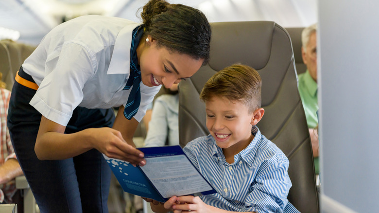 flight attendant and child reading